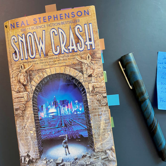 Snow Crash book cover, pen and sticky note